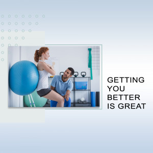 A fitness trainer assisting a woman with exercise using a stability ball.