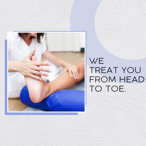 Physical therapist examining a patient's leg.