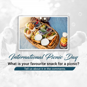 Picnic basket filled with food and drinks with text 'International Picnic Day'