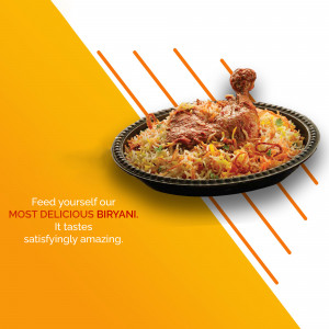 Close-up of a flavorful biryani dish with chicken, served in a black tray.