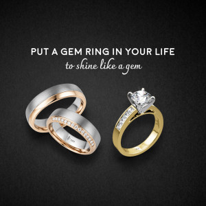 Close-up of three elegant gem rings on a black background