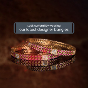 Close-up of gold bangles with red and white stone detailing