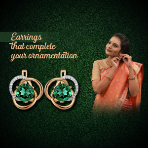 Close-up of gold earrings with emerald green stones and a woman wearing a saree.