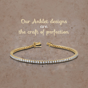 Close-up of a delicate gold ankle bracelet with sparkling diamonds.