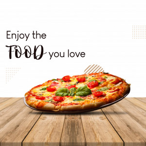 A mouthwatering pizza with fresh tomatoes and basil on a wooden table.