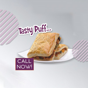 Close-up of a Tasty Puff pastry on a white plate with a purple and white background.