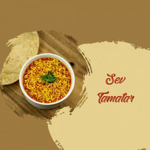 A bowl of Sev Tamatar with papad