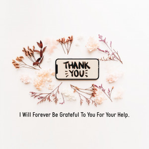 Smartphone displaying 'Thank You' message surrounded by dried flowers