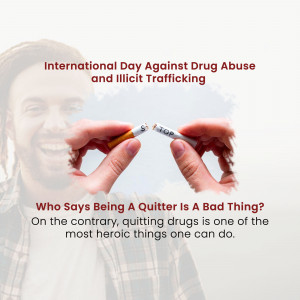 Hands breaking a cigarette with a blurred smiling face in the background, promoting quitting drugs.