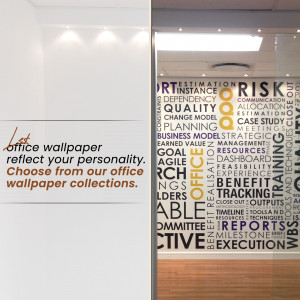 Close-up of office wallpaper with text and a glass door in the background