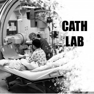 Medical professionals performing a cardiac catheterization in a hospital cath lab.