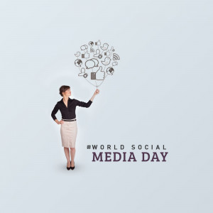 Woman holding a balloon shaped like social media icons