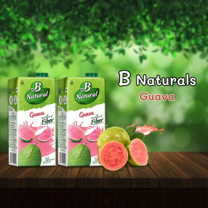 Two cartons of B Naturals Guava juice with guava fruits and splash