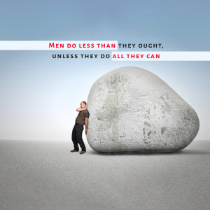Man pushing against a large rock with motivational text.