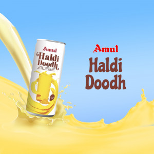 Amul Haldi Doodh can with splash of turmeric milk