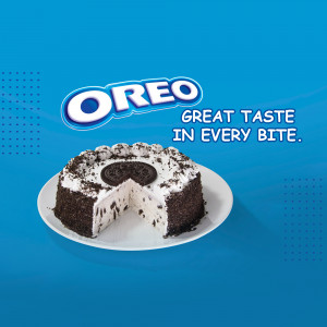 A delicious Oreo-flavored chocolate cream cake with a slice removed, showcasing the Oreo cookie center.