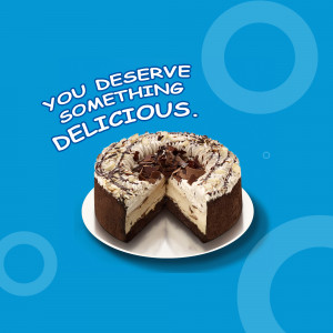 A slice of chocolate cheesecake on a white plate with a blue background.