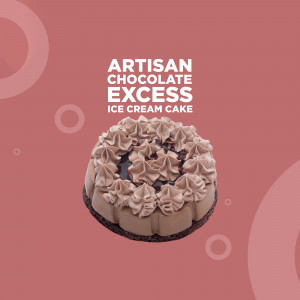 A beautifully decorated chocolate ice cream cake with swirls of chocolate frosting on a coral background.