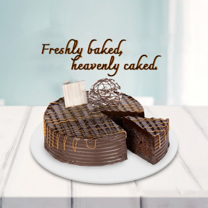 A delicious chocolate cake with a slice removed, drizzled with caramel.