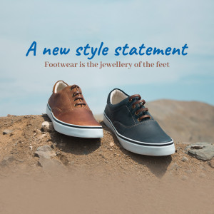 Brown and navy blue casual shoes on a sandy surface