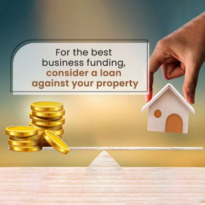 Image depicting business funding secured against property, showing a hand pulling a tab revealing a house and coins.