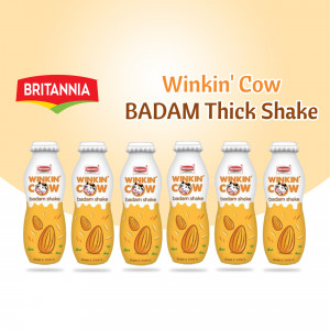 Six bottles of Britannia Winkin' Cow Badam Thick Shake with almond illustrations.