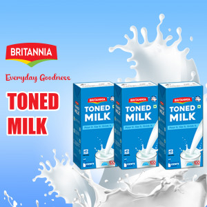Three cartons of Britannia Toned Milk with a milk splash