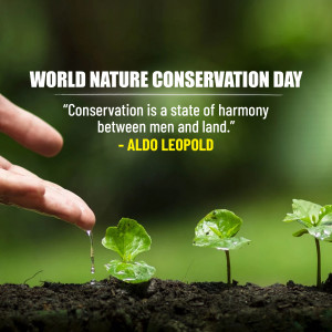 A hand watering a seedling with a blurred green background and text celebrating World Nature Conservation Day.