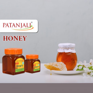 Patanjali Honey jars with honeycomb and flowers