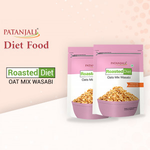 Two pouches of Patanjali Roasted Diet Oats Mix Wasabi against a pink background.