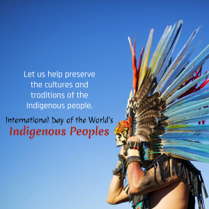 A person wearing a traditional Indigenous headdress with feathers against a blue sky, promoting cultural preservation.