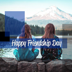 Two women sitting by a lake with a mountain backdrop and 'Happy Friendship Day' text.