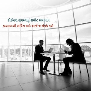 Two business professionals in a meeting, discussing documents.