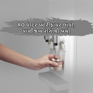 A hand filling a glass with water from a modern RO water purifier.