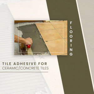 Close-up of a worker applying tile adhesive to a ceramic tile floor.