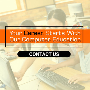 Students in a computer lab with a promotional banner.
