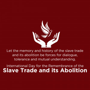 White dove in hands with text commemorating the International Day for the Remembrance of the Slave Trade and its Abolition.