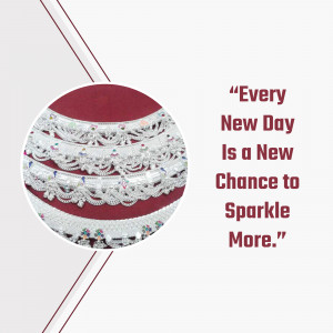 Close-up of silver anklets with a motivational quote 'Every New Day Is a New Chance to Sparkle More.'