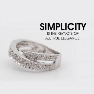 Close-up of a silver ring with diamonds, featuring the text 'Simplicity is the keynote of all true elegance.'