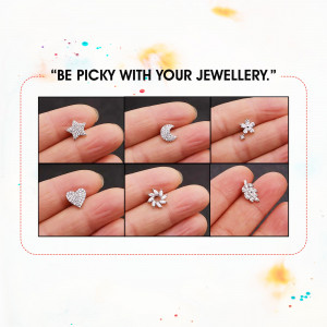 A collection of dainty silver stud earrings in various shapes.