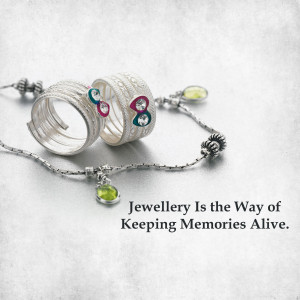 Close-up of silver rings and bracelet with colorful gemstones