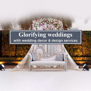 Elegant wedding decor with a floral arrangement and ornate seating.