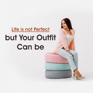 Woman sitting on tires with a fashion quote