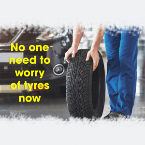 Mechanic holding a tire with a car in the background and text 'No one need to worry of tyres now'