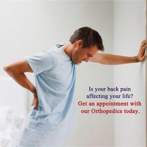 Man experiencing back pain leaning against a wall with text promoting orthopedics appointment.