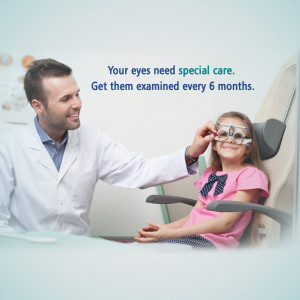 Optometrist examining a young girl's eyes