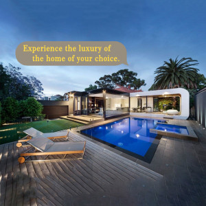 Exterior view of a modern house with a swimming pool and lounge chairs.