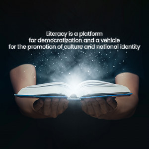Hands holding an open book with light emanating from it, symbolizing literacy and knowledge.