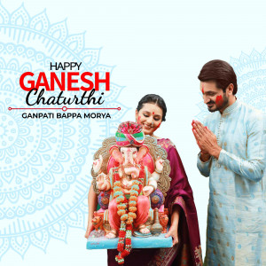 Couple celebrating Ganesh Chaturthi with an idol of Lord Ganesha
