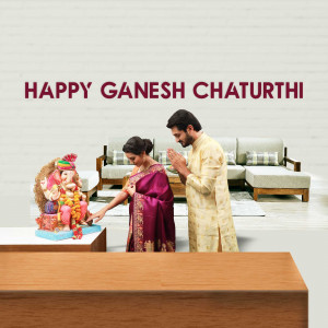 A couple performing puja to Lord Ganesha during Ganesh Chaturthi